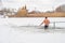Poltava, Ukraine. January 19. 2022. A man descends into the water in winter, the feast of the Epiphany. Orthodox winter