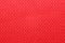 Polyester cationic texture material red synthetic fabric macro elastic band background closeup