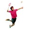 Polygonal professional badminton player doing smash shot on white background
