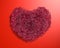 Polygonal red heart of the particles of plexus, realistic 3D on red paper background with backlight