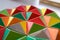 polygonal surface with colored triangles, tessellation of a three-dimensional floor with colored polygons. decoration with