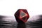 A polyhedral twenty sided die used for role playing games such a