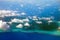 Polynesia. The atoll in ocean through clouds.Sea tropical landscape in a sunny day