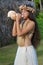 Polynesian Cook Islander woman blowing conch shell in Rarotonga