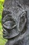 Polynesian male figurine rock carving in basalt sculpture