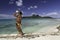 Polynesian man playing shell and ukulele on Bora Bora Island beach and Lagoon - French Polynesia