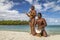 Polynesian men playing traditional instruments on Bora Bora beach - French Polynesia