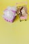 Polythene and paper bags in a shopping basket on a yellow background