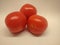 Pomadora three red tomatoes still life