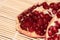 Pomegranate berries on a beige wooden background. Pomegranate