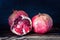 Pomegranate, delicious and ripe fruit on black background