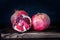 Pomegranate, delicious and ripe fruit on black background