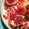 Pomegranate elegance Fresh pomegranate pieces artfully arranged on a plate