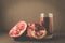 Pomegranate fruit and juice in glass/Pomegranate fruit and juice in glass on dark background, selective focus