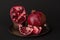 Pomegranate fruit. Pomegranates over black Background.