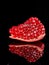 Pomegranate fruit. Pomegranates over black Background. Organic Bio fruits