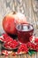 Pomegranate juice with ripe fresh punica granatum fruits