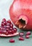 Pomegranate, natural antioxidant, vertical background