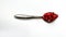 Pomegranate pearls on spoon Pomegranate on spoon