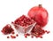 Pomegranate with pieces and grains isolated