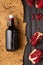 Pomegranate, scattered seeds and pomegranate juice on a dark wooden background top view