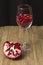 Pomegranate seed inside transparent wine glass