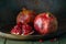 pomegranate seeds fruit Fresh ripe wooden background open dark vintage background still life organic Red vitamins wooden plate