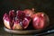 pomegranate seeds fruit Fresh ripe wooden background open dark vintage background still life organic Red vitamins wooden plate