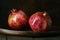 pomegranate seeds fruit Fresh ripe wooden background open dark vintage background still life organic Red vitamins wooden plate