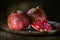 pomegranate seeds fruit Fresh ripe wooden background open dark vintage background still life organic Red vitamins wooden plate