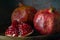 pomegranate seeds fruit Fresh ripe wooden background open dark vintage background still life organic Red vitamins wooden plate