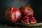 pomegranate seeds fruit Fresh ripe wooden background open dark vintage background still life organic Red vitamins wooden plate