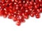 Pomegranate seeds on white