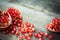 Pomegranate slices and garnet fruit seeds on table.