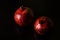 Pomegranates on black background. Pomegranate closeup