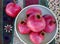 Pomegranates in green retro bowl on print tablecloth