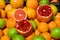 Pomegranates, oranges, apples, grappefruit in market