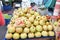 Pomegranates are stacked in pile on Turkish farmer market. Fruit and vegetable marketplace is in the Alanya, Turkey