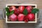 Pomegranates in wooden box