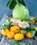 Pomelo, pomegranate and tangerine on a wooden table