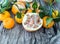 Pomelo, pomegranate and tangerine on a wooden table