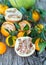 Pomelo, pomegranate and tangerine on a wooden table