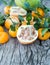 Pomelo, pomegranate and tangerine on a wooden table