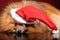 Pomeranian spitz lying in Santa hat