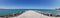 Pomorie / Bulgaria - july 18, 2019: Panorama landscape view of pier covered with breakwaters around, which protects the beach