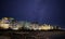 Pomorie town with lights and hotels against the backdrop of the night sky and the Black Sea in Bulgaria