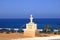 Pomos village, Paphos district, Representation of the Idol of Pomos on a welcome sign. Translation of the Greek words: 3500 BC,