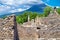 Pompeii, archeological site, Ancient ruins of dying town with view on smoking Mount Vesuvius.