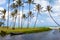 Pond, boat and sea among palm trees