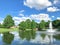 Pond with cloud reflection and water fountain in small American neighborhood